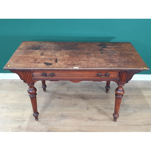 468 - A Victorian walnut Library Table in the Aesthetic manner fitted frieze drawer raised on turned suppo... 