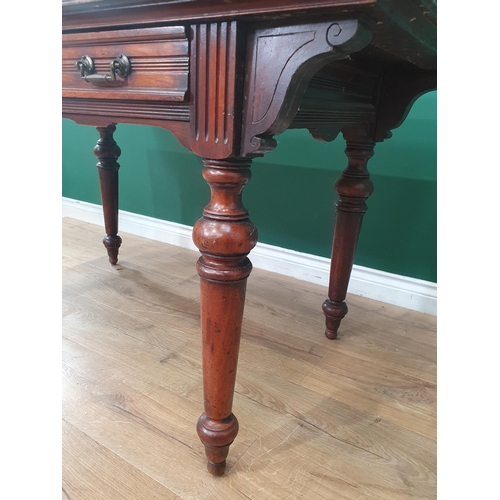 468 - A Victorian walnut Library Table in the Aesthetic manner fitted frieze drawer raised on turned suppo... 