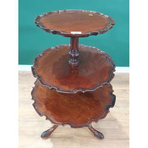 469 - A George III mahogany three tier Dumb Waiter with shaped pie crust tiers on tripod base with shall c... 