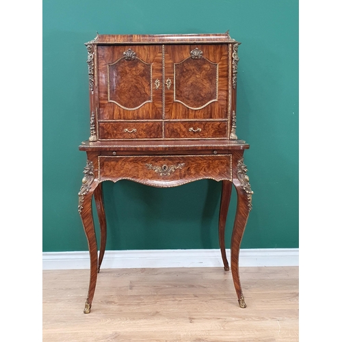 481 - A French 19th Century walnut Bonheur du Jour fitted pair of cupboard doors above two drawers and sin... 