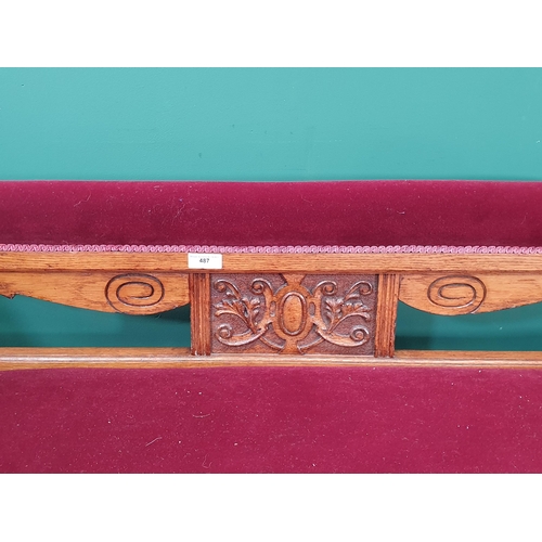 487 - An Edwardian oak framed Chaise Lounge with claret upholstery 5ft 10in L x 2ft 8in H