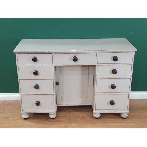 510 - An antique grey painted Kneehole Desk fitted nine drawers 4ft W x 2ft 8in H