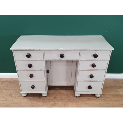 510 - An antique grey painted Kneehole Desk fitted nine drawers 4ft W x 2ft 8in H