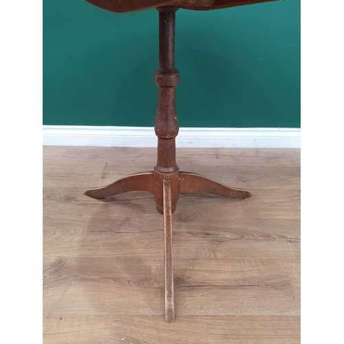 514 - A painted pine Tripod Table, the circular four piece top on, on turned column support and tripod bas... 