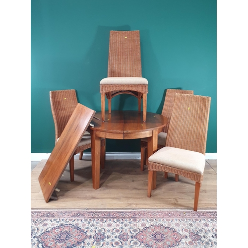 518 - A modern extending Dining Table with spare leaf 5ft 2in L x 2ft 6in H and four wicker Chairs