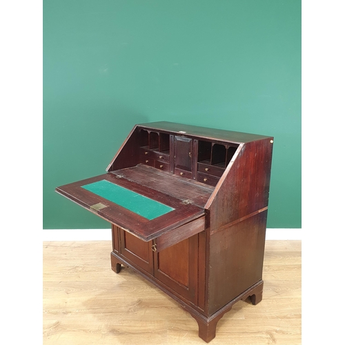 525 - A Scottish 19th Century mahogany Bureau, the fall front enclosing fitted drawer and pigeon hole inte... 