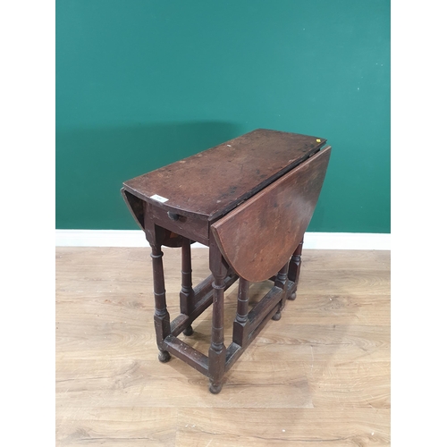 538 - An antique oak Gateleg Table with single fitted drawer, on turned supports united by square stretche... 