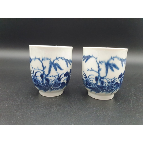 55 - Two early Worcester blue and white Tea Cups, decorated candle fence pattern, open crescent mark, sma... 