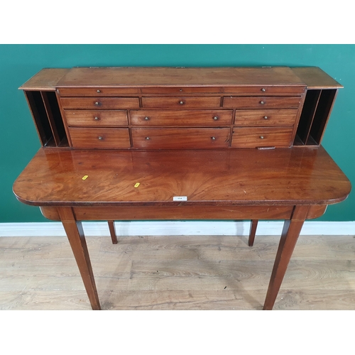 554 - A mahogany made up Bonheur de Jour, the top with twelve fitted drawers, on d-end base, on square tap... 