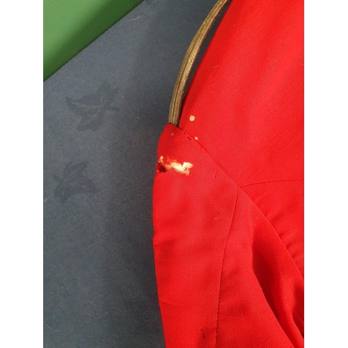 578 - A Childs red Military style Jacket (Moth Damaged).