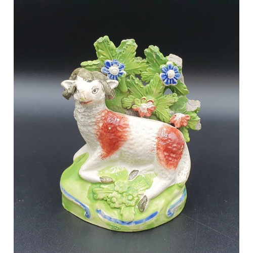 58 - An early Staffordshire pottery Cow and Calf with bocage background, 5in, another of a horned Sheep, ... 