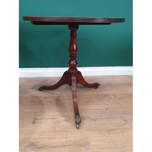 584 - A mahogany tilt top Tripod Table on turned column, and a reproduction Pillar Table with paw toecaps ... 