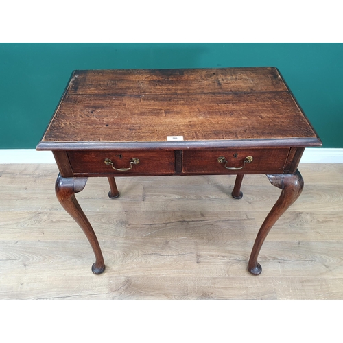 586 - An oak Side Table fitted pair of drawers on cabriole supports, 2ft 6