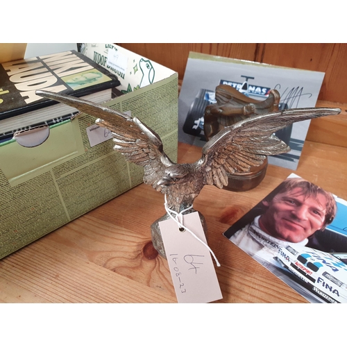 64 - A plated Eagle Car Mascot, a flying Spirit Desk Paperweight, Motoring Books, signed Photographs, etc