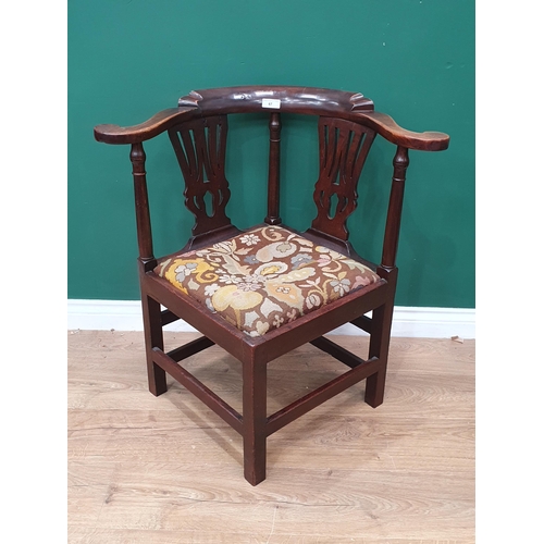 67 - A Georgian mahogany Corner Chair with shaped arms, turned supports, upholstered drop in seat, replac... 