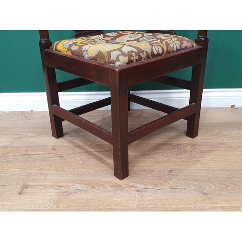 67 - A Georgian mahogany Corner Chair with shaped arms, turned supports, upholstered drop in seat, replac... 