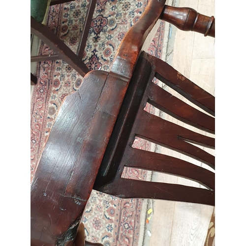 67 - A Georgian mahogany Corner Chair with shaped arms, turned supports, upholstered drop in seat, replac... 