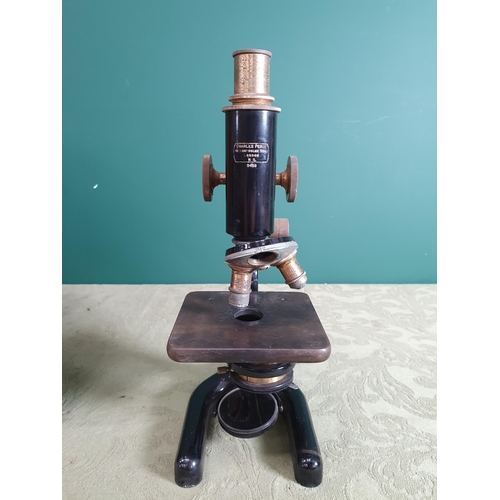 801 - A Charles Perry brass and black coated Microscope in case