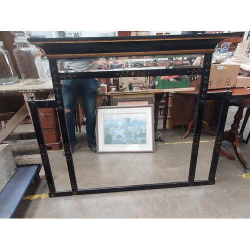 808 - An ebonised Over mantle Mirror with gilt carved floral decorations, 3ft 7