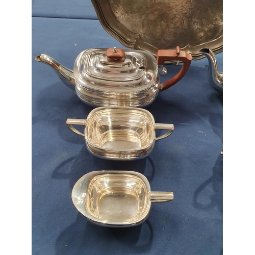 90 - Two plated three piece Tea Services and a large plated Salver with leafage scroll engraving, 16in