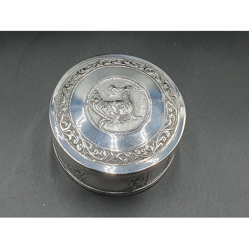 92 - An Eastern silver circular Box and Cover decorated bird, six foreign Spoons with figure finials and ... 