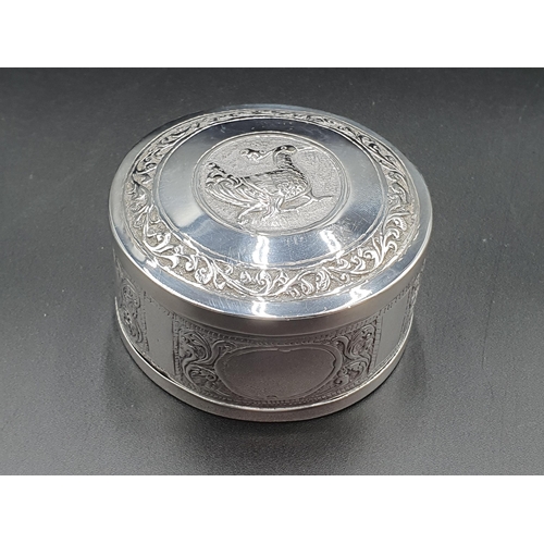 92 - An Eastern silver circular Box and Cover decorated bird, six foreign Spoons with figure finials and ... 