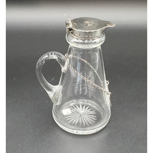 97 - A George V silver lidded Toddy Flask, Birmingham 1935, and a Whisky Label, London 1903