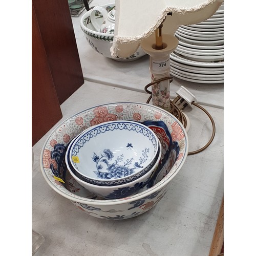 374 - A Chinese blue and white Bowl, two Bowls and a Moorcroft Table Lamp (passed PAT, fuse removed)