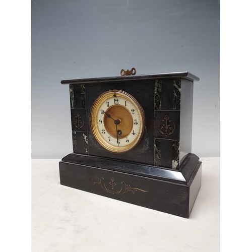 65 - An engraved black marble/slate Mantel Clock with circular dial and key, 9in H