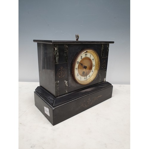 65 - An engraved black marble/slate Mantel Clock with circular dial and key, 9in H