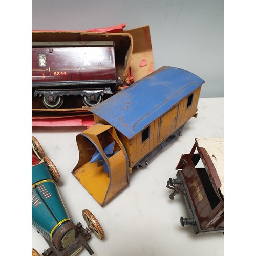 73 - A Hornby 0 gauge No.2 L.M.S. Coach, No.1 Wagons, clockwork Racing Car and toy Sewing Machine