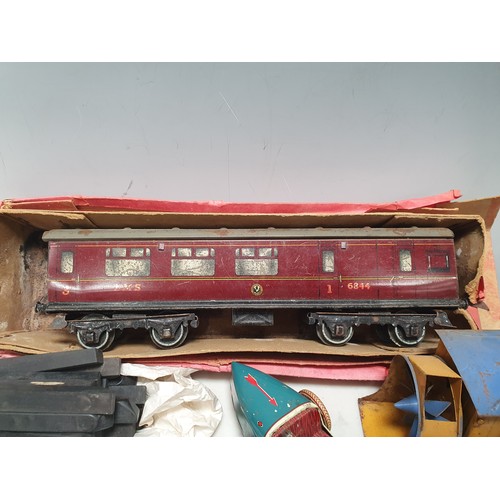 73 - A Hornby 0 gauge No.2 L.M.S. Coach, No.1 Wagons, clockwork Racing Car and toy Sewing Machine