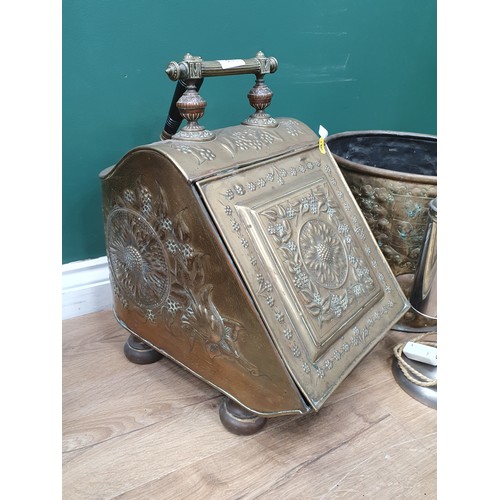 519 - An Arts and Crafts brass Coal Box, a copper Log Bin with lion mask ring handles and a plated Student... 