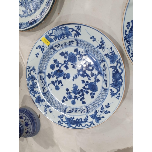 358 - Two 19th Century blue and white Chinese Plates with central floral designs A/F 11