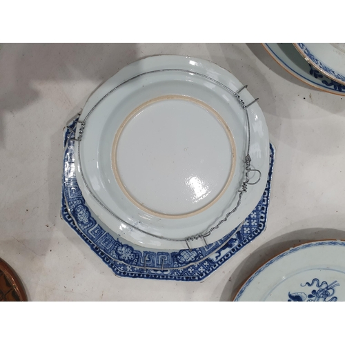 358 - Two 19th Century blue and white Chinese Plates with central floral designs A/F 11