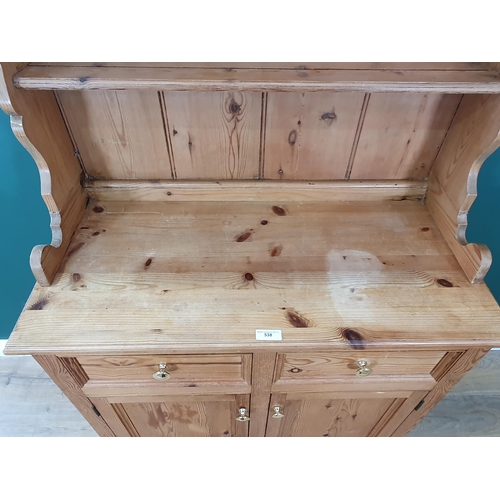 538A - A small pine Dresser and Rack, the base fitted two drawers and a pair of cupboard doors, 6ft 2in H x... 