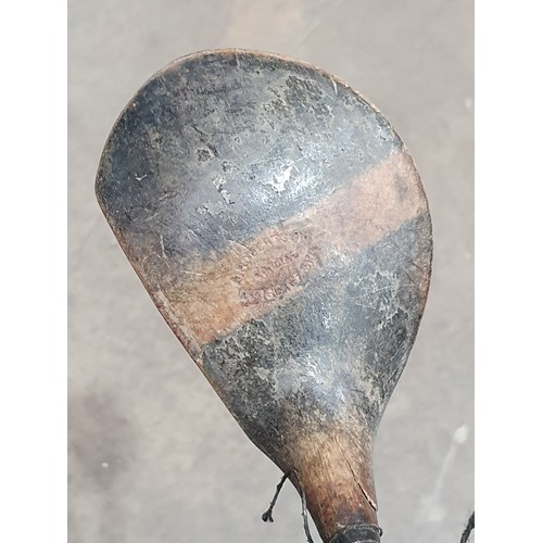 559 - A quantity of vintage wooden handled Golf Clubs.