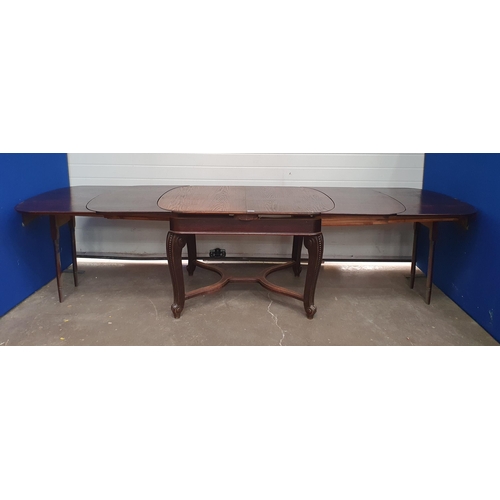 551 - An oak extending Dining Table on cabriole supports united by X-stretcher 4ft W x 2ft 8in H. (R4).