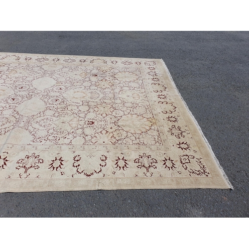 1 - An Ushak style wool Carpet the beige and maroon sylised floral design on cream ground, 10ft x 14ft, ... 