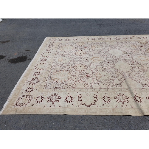 1 - An Ushak style wool Carpet the beige and maroon sylised floral design on cream ground, 10ft x 14ft, ... 