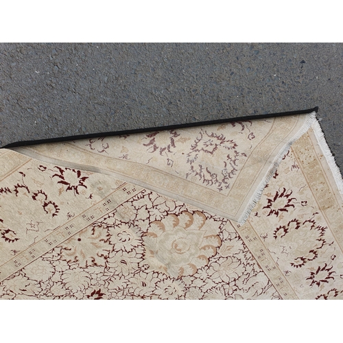 1 - An Ushak style wool Carpet the beige and maroon sylised floral design on cream ground, 10ft x 14ft, ... 