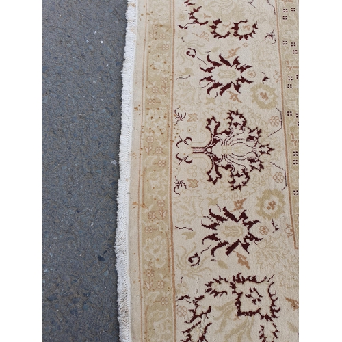 1 - An Ushak style wool Carpet the beige and maroon sylised floral design on cream ground, 10ft x 14ft, ... 