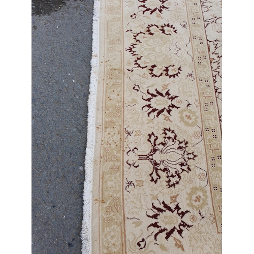 1 - An Ushak style wool Carpet the beige and maroon sylised floral design on cream ground, 10ft x 14ft, ... 