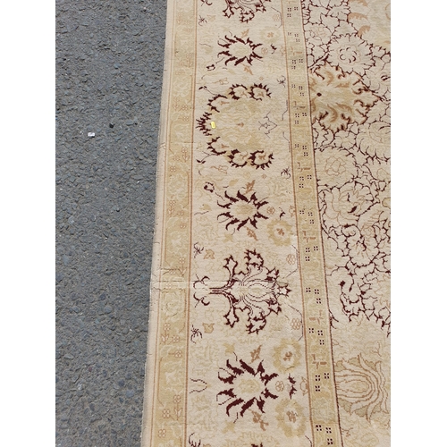 1 - An Ushak style wool Carpet the beige and maroon sylised floral design on cream ground, 10ft x 14ft, ... 