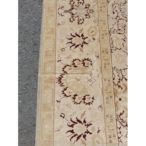 1 - An Ushak style wool Carpet the beige and maroon sylised floral design on cream ground, 10ft x 14ft, ... 