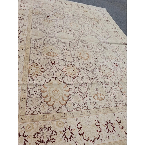 1 - An Ushak style wool Carpet the beige and maroon sylised floral design on cream ground, 10ft x 14ft, ... 