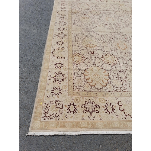 1 - An Ushak style wool Carpet the beige and maroon sylised floral design on cream ground, 10ft x 14ft, ... 