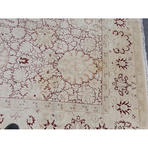 1 - An Ushak style wool Carpet the beige and maroon sylised floral design on cream ground, 10ft x 14ft, ... 