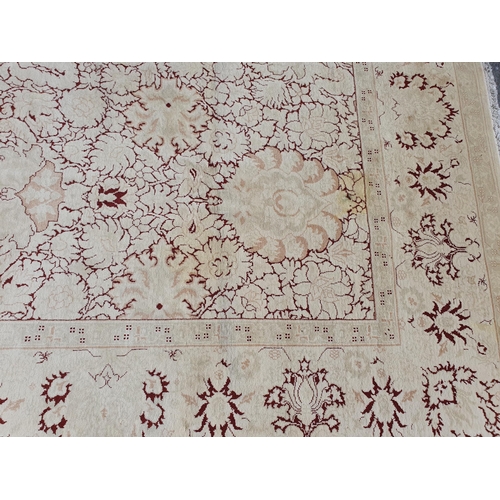 1 - An Ushak style wool Carpet the beige and maroon sylised floral design on cream ground, 10ft x 14ft, ... 