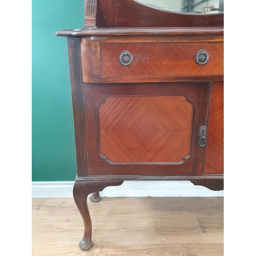 10 - A mahogany mirror back Sideboard, fitted pair of drawers above pair of panelled doors raised on cabr... 